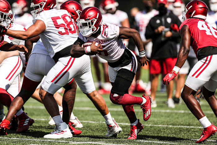 Indiana sophomore running back Sampson James carries the ball during Indiana's fall practice on Aug. 9.
